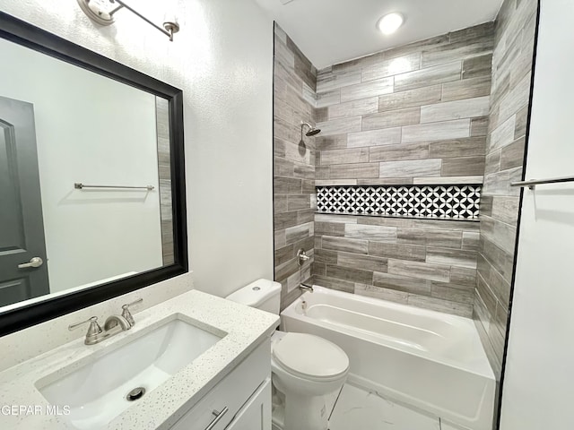 full bathroom featuring toilet, tiled shower / bath combo, and vanity