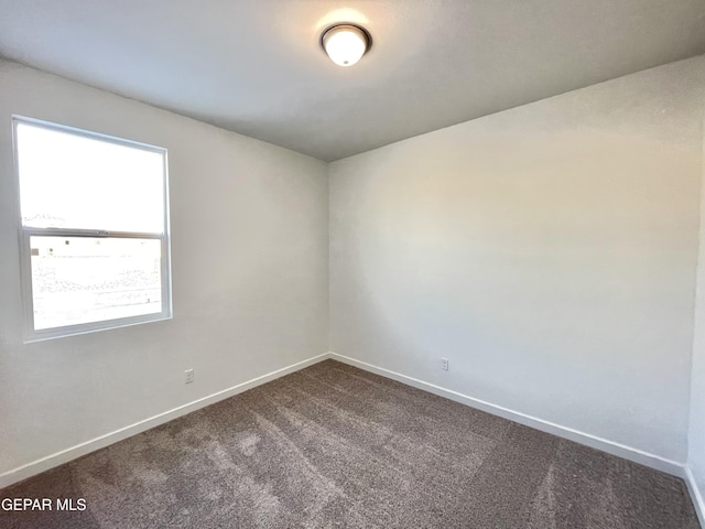 unfurnished room with carpet floors