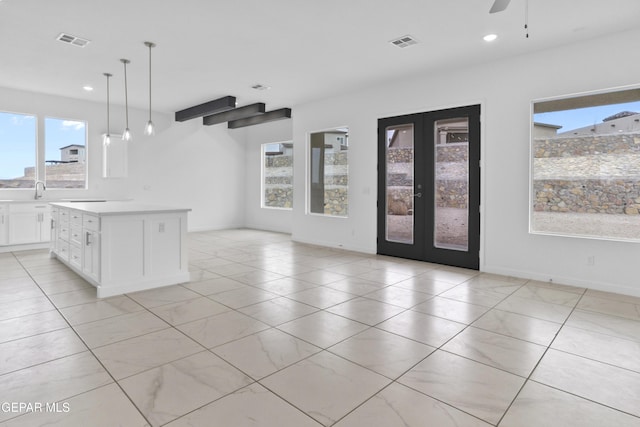 interior space featuring light tile patterned floors, ceiling fan, and french doors