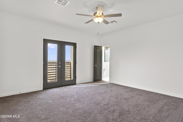 carpeted spare room with french doors and ceiling fan