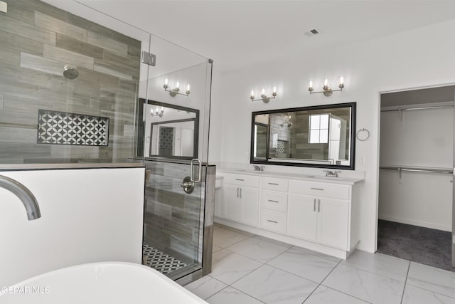 bathroom with vanity and independent shower and bath