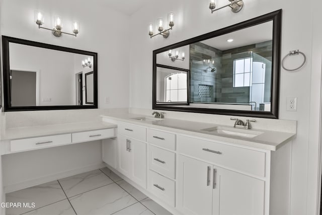 bathroom with vanity and a shower with door