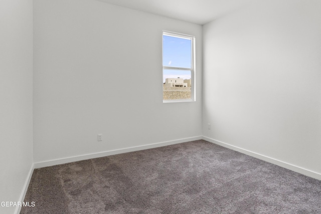 unfurnished room featuring carpet flooring