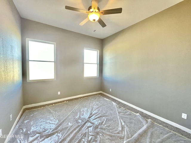 spare room with ceiling fan