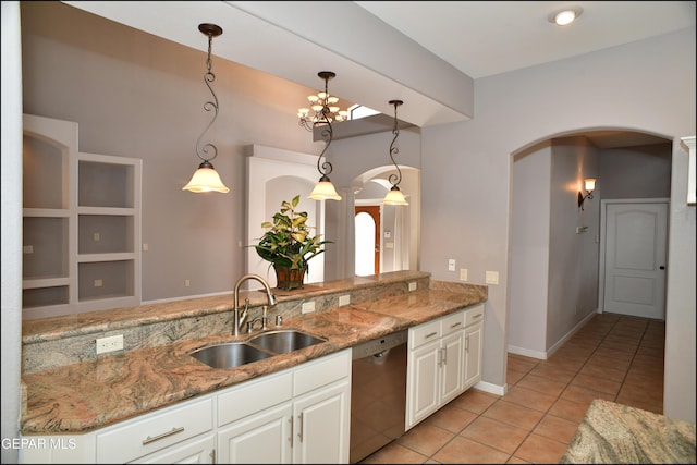 kitchen with pendant lighting, dishwasher, sink, built in features, and white cabinetry