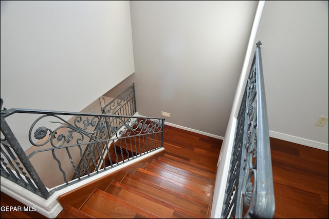 stairway featuring hardwood / wood-style flooring