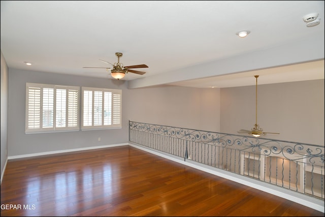 unfurnished room featuring dark hardwood / wood-style flooring