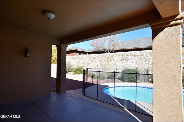 view of swimming pool with a patio area