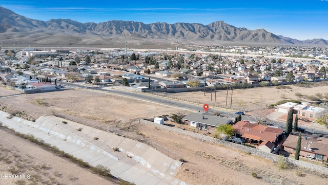 birds eye view of property with a mountain view