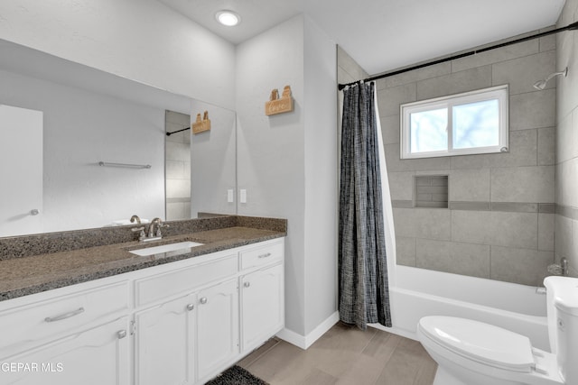 full bathroom featuring shower / tub combo, vanity, and toilet