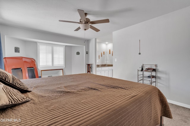 bedroom featuring carpet flooring, connected bathroom, ceiling fan, and sink