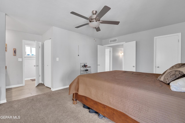 bedroom with ceiling fan and light carpet