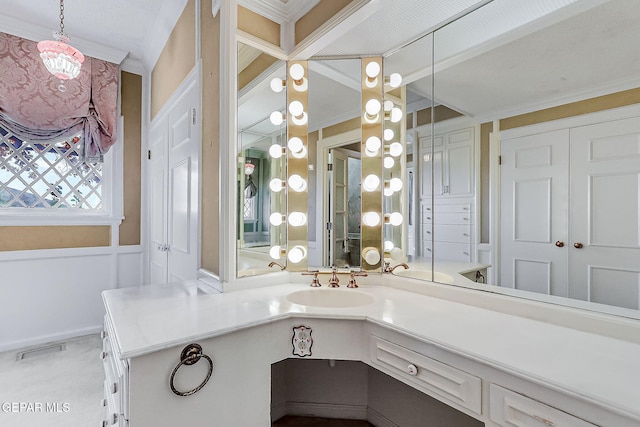 bathroom featuring vanity and crown molding