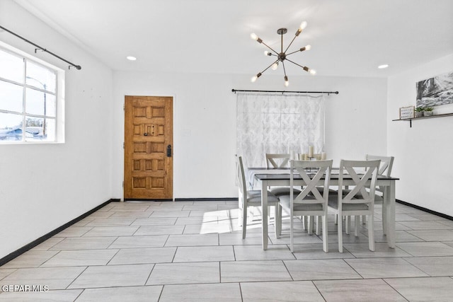 dining room with a notable chandelier