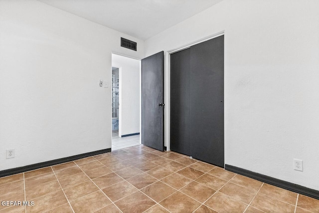 view of tiled spare room