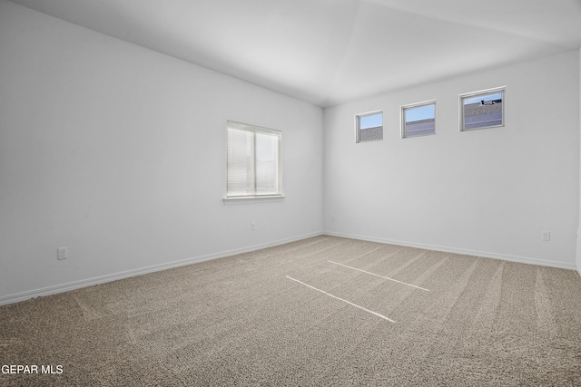 unfurnished room featuring carpet