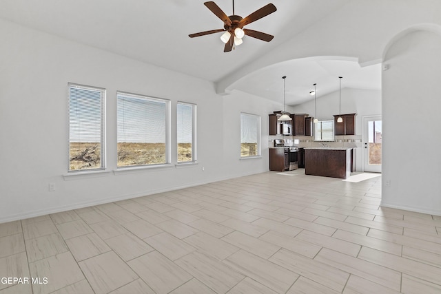 unfurnished living room with ceiling fan, light tile patterned flooring, and lofted ceiling