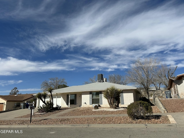 single story home with a garage