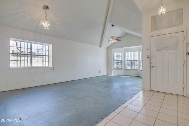 tiled entrance foyer with vaulted ceiling with beams and ceiling fan with notable chandelier