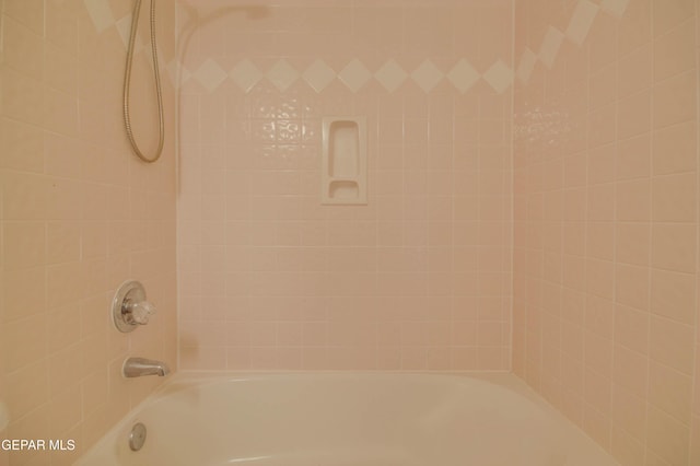 interior details with tiled shower / bath