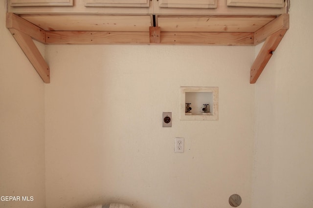 laundry area featuring cabinets, washer hookup, and electric dryer hookup