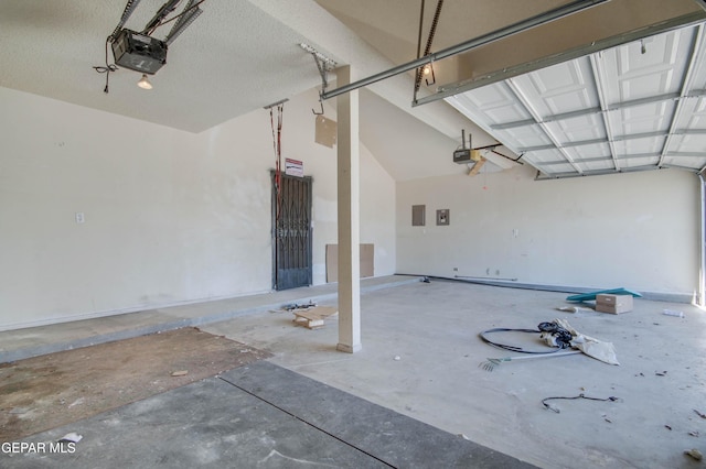 garage with electric panel and a garage door opener