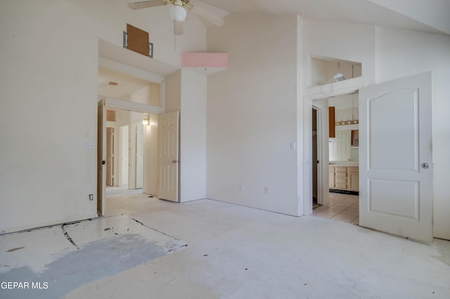 unfurnished bedroom featuring ceiling fan and high vaulted ceiling