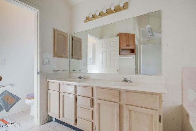 bathroom featuring tile patterned floors, vanity, and toilet