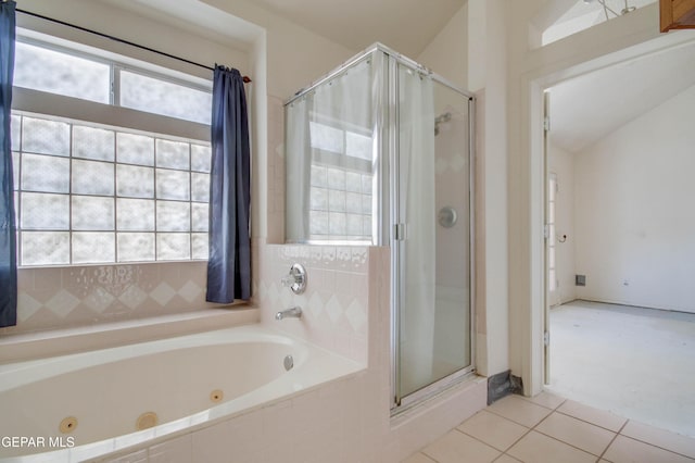 bathroom featuring tile patterned floors, plenty of natural light, plus walk in shower, and lofted ceiling