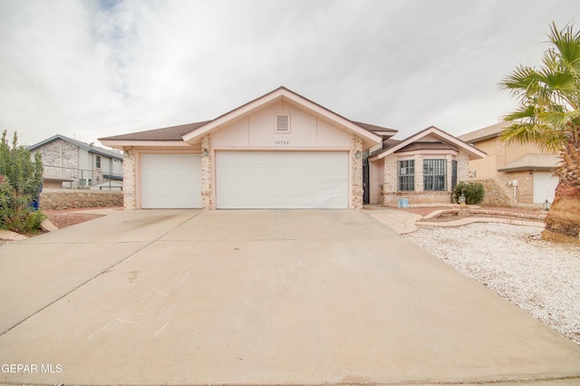 ranch-style home featuring a garage