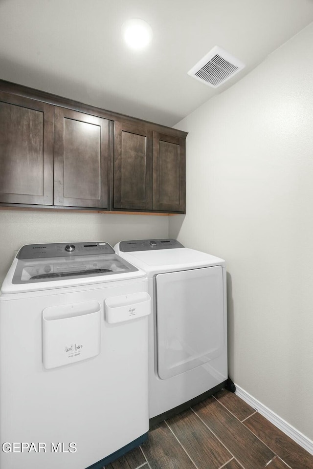 laundry area with cabinets and independent washer and dryer