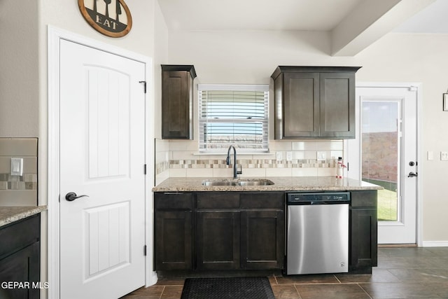 kitchen featuring dishwasher, sink, a wealth of natural light, and tasteful backsplash