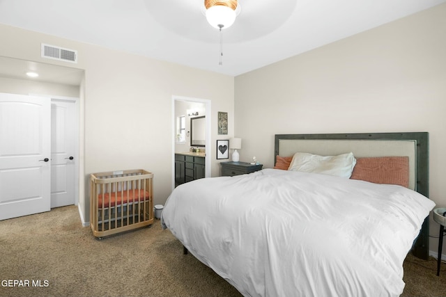 carpeted bedroom featuring ceiling fan, sink, and connected bathroom