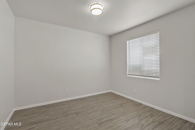 spare room featuring hardwood / wood-style floors