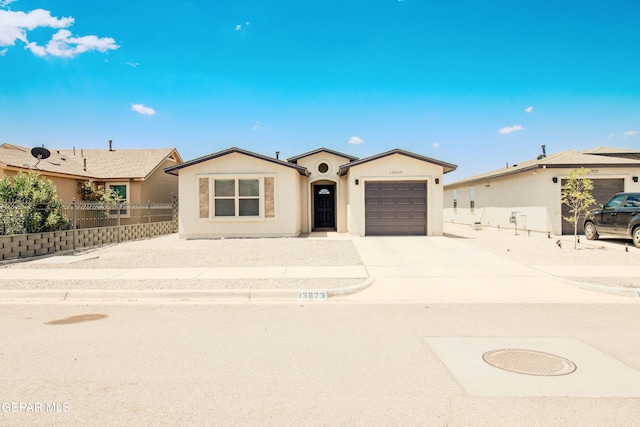 ranch-style house featuring a garage