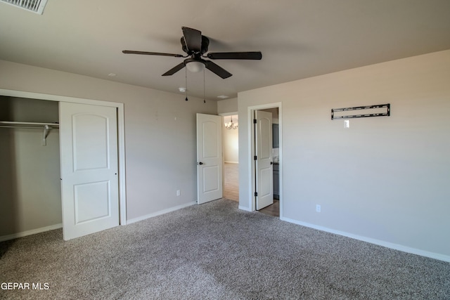 unfurnished bedroom featuring carpet floors, a closet, and ceiling fan