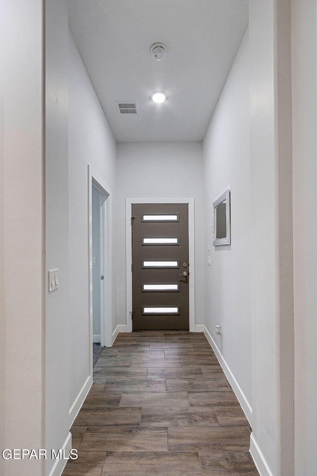 entryway with dark wood-type flooring