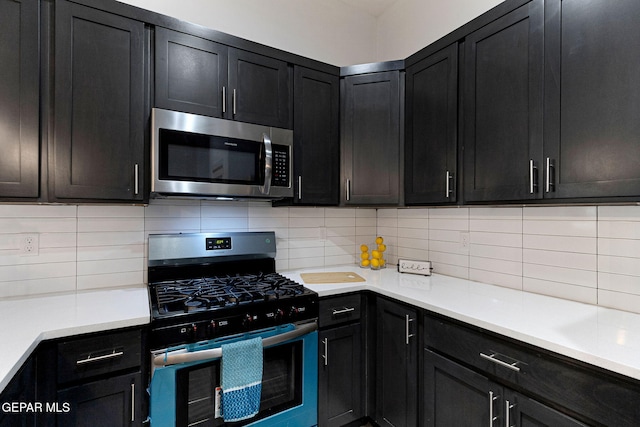 kitchen with decorative backsplash and stainless steel appliances