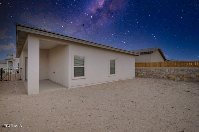 rear view of property with a patio