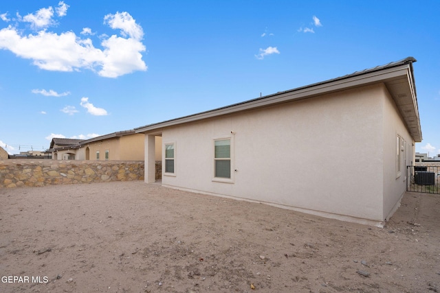 back of property with central AC unit