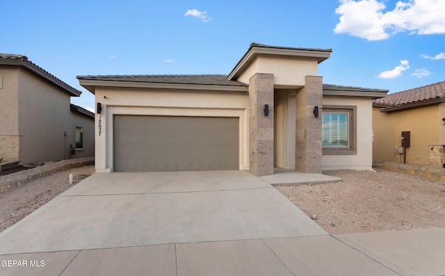 prairie-style home with a garage