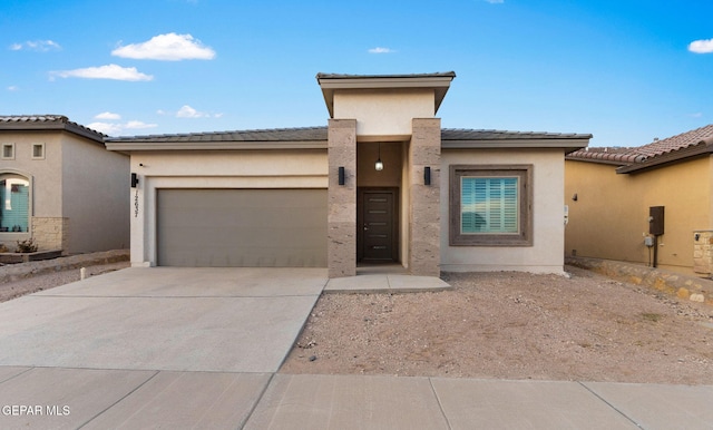 prairie-style home featuring a garage