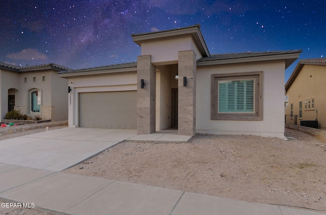 view of front of property featuring a garage