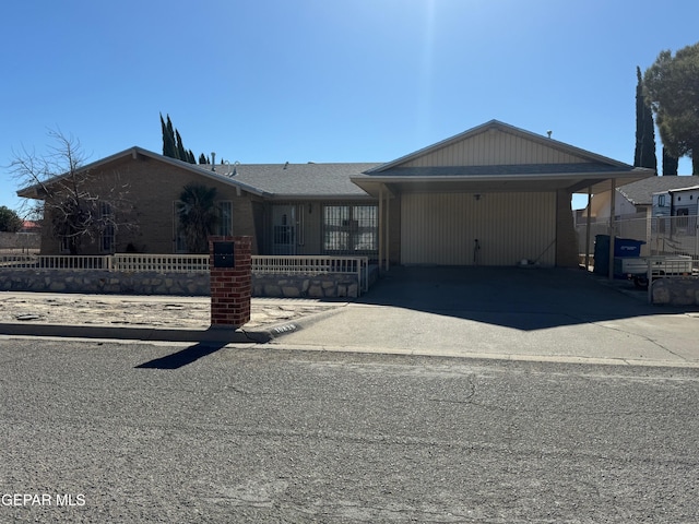 ranch-style house with a carport