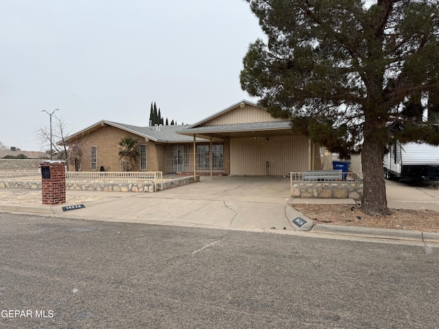 view of front of property with a carport