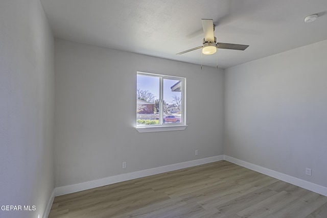 unfurnished room featuring light wood-type flooring and ceiling fan