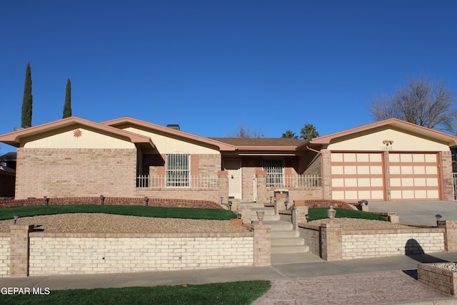 ranch-style house featuring a garage