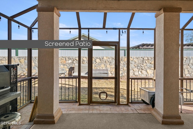 entryway featuring light colored carpet