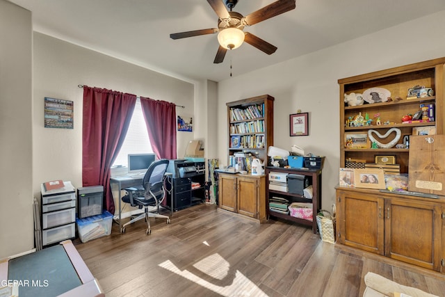 office with ceiling fan and hardwood / wood-style floors