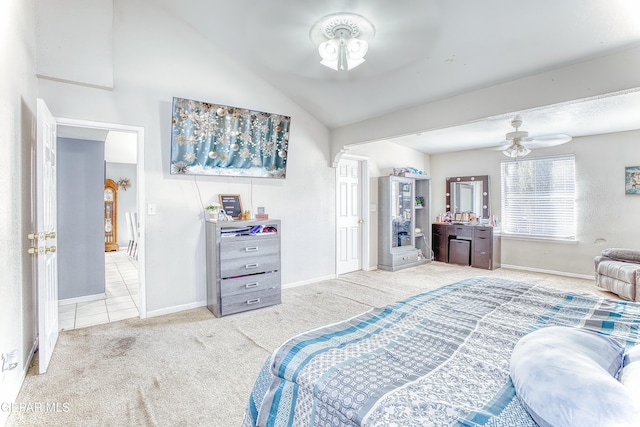 bedroom with carpet, vaulted ceiling, and baseboards